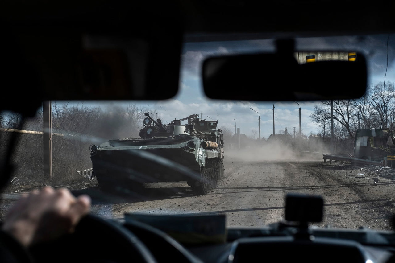An armoured vehicle seen through a windscreen.